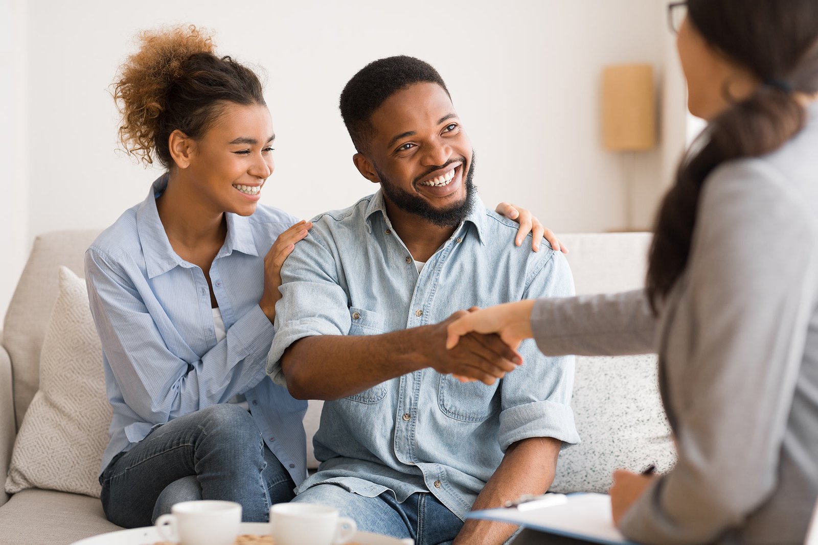 Young African American Couple Handshaking with the Therapist